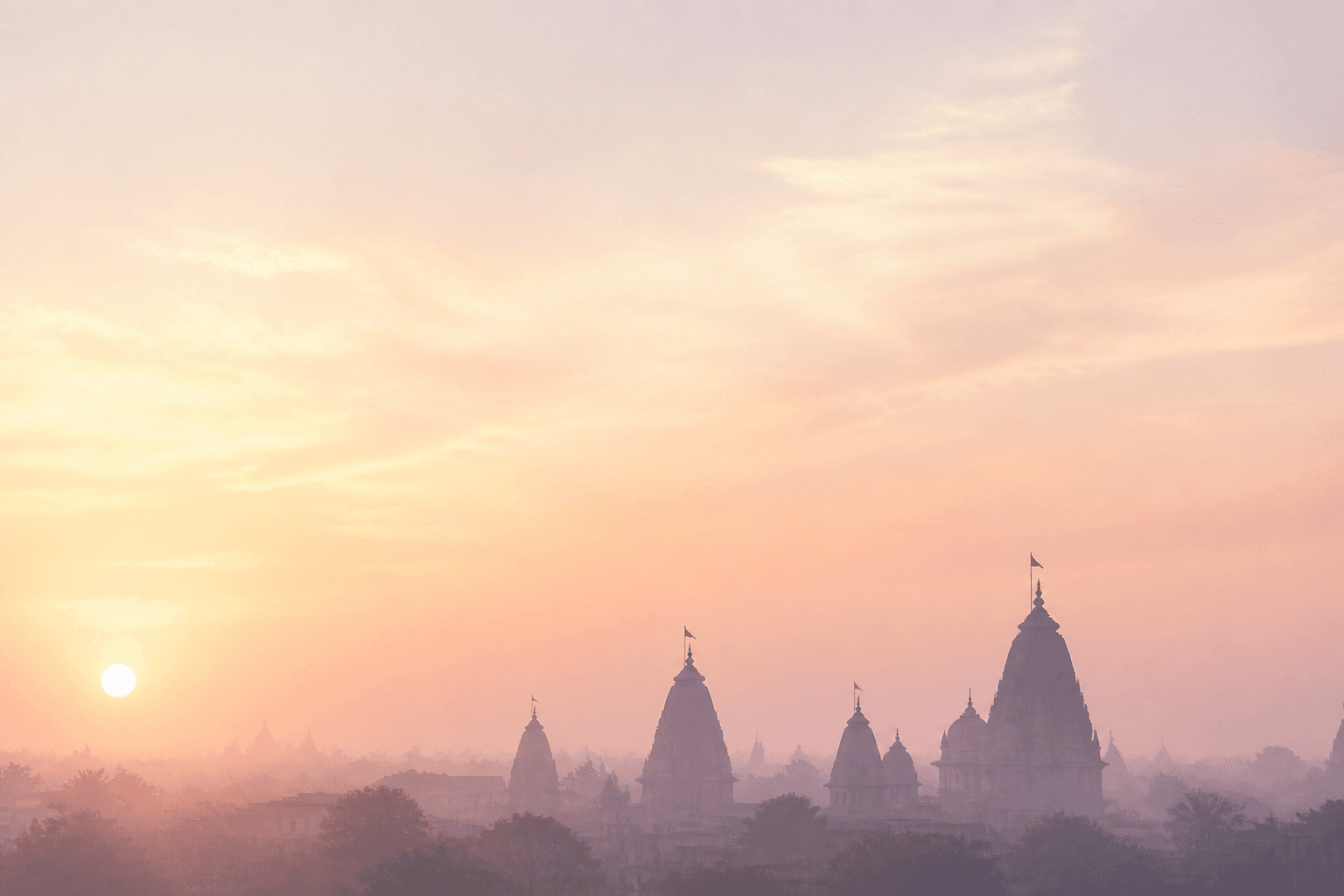 Temple spires against a sunrise sky